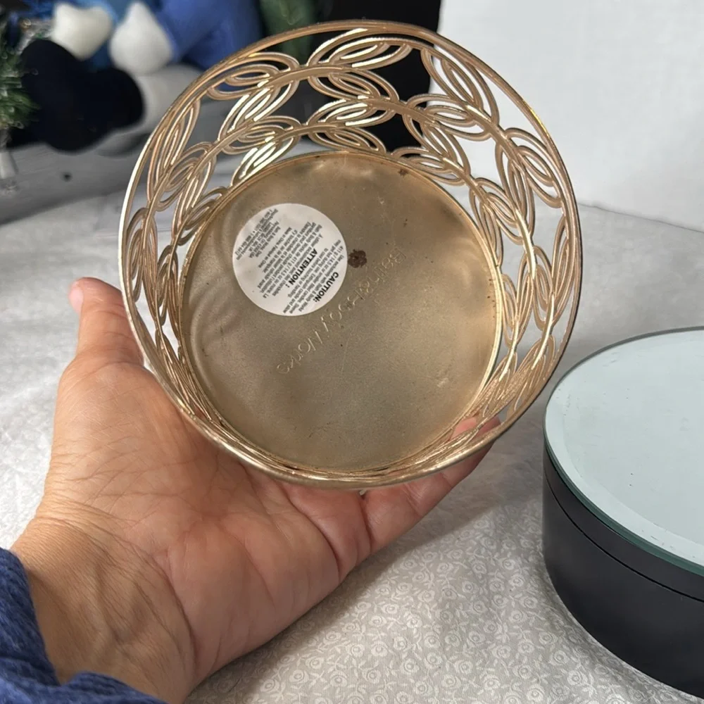 Bath & body Works candle holder rose gold holds a three wick candle